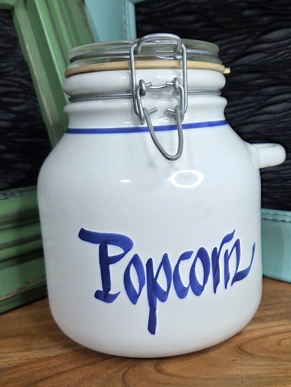 Vintage Clay Designs white ceramic popcorn canister, blue lettering "Popcorn"